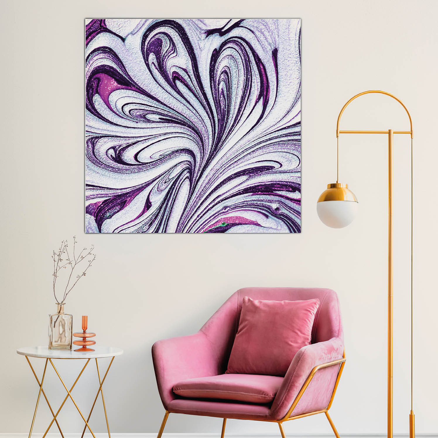 Picture frame with abstract art by a pink velvet armchair