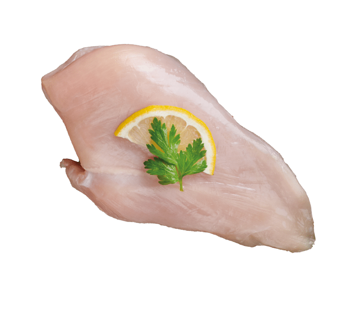 Raw chicken Breasts on a chopping Board. Fresh fillet. Fresh chicken meat, Chicken fillet with spices at black stone table. Top view with copy space.